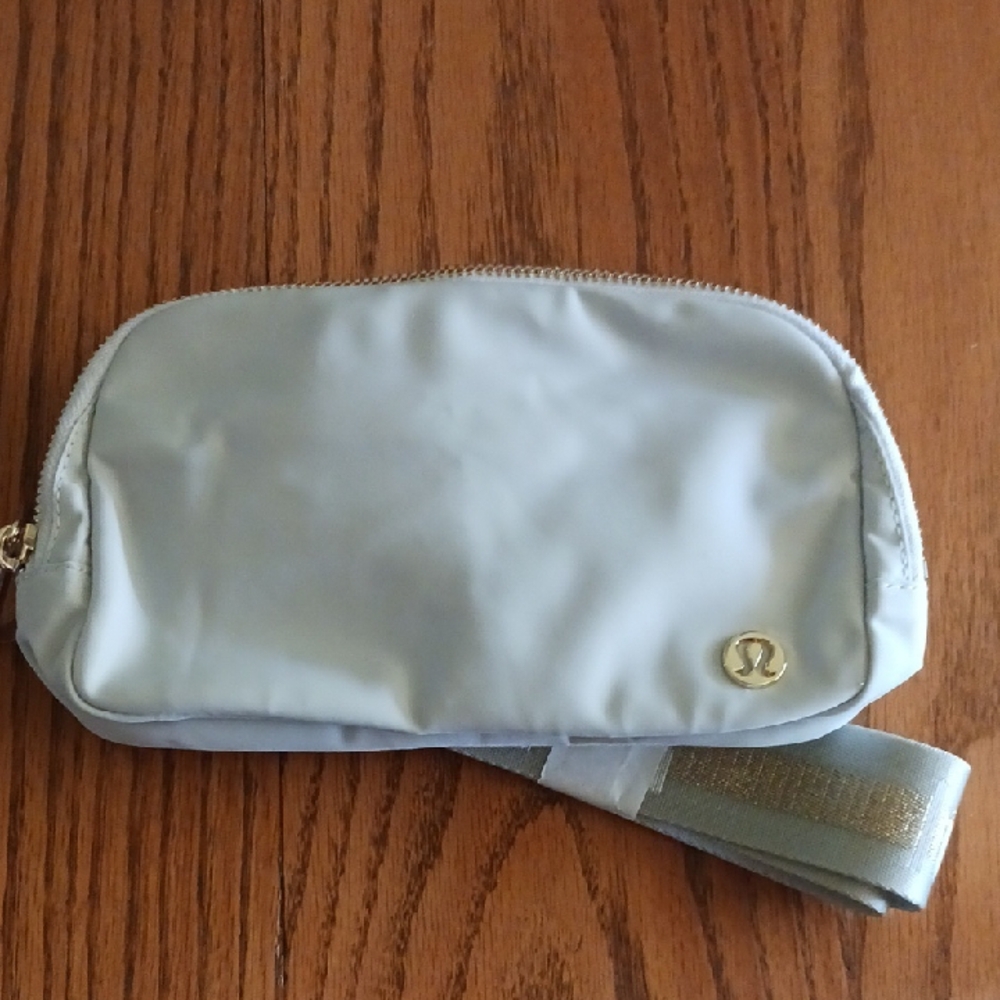 Lululemon Light Gray Crossbody, Belt Bag/gold hardware. NWT